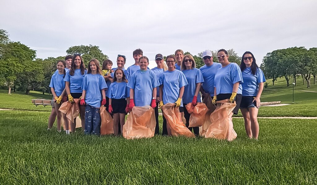 Group of 15 people from Century 21 Pro Link gathered for a picture while at trash pickup day